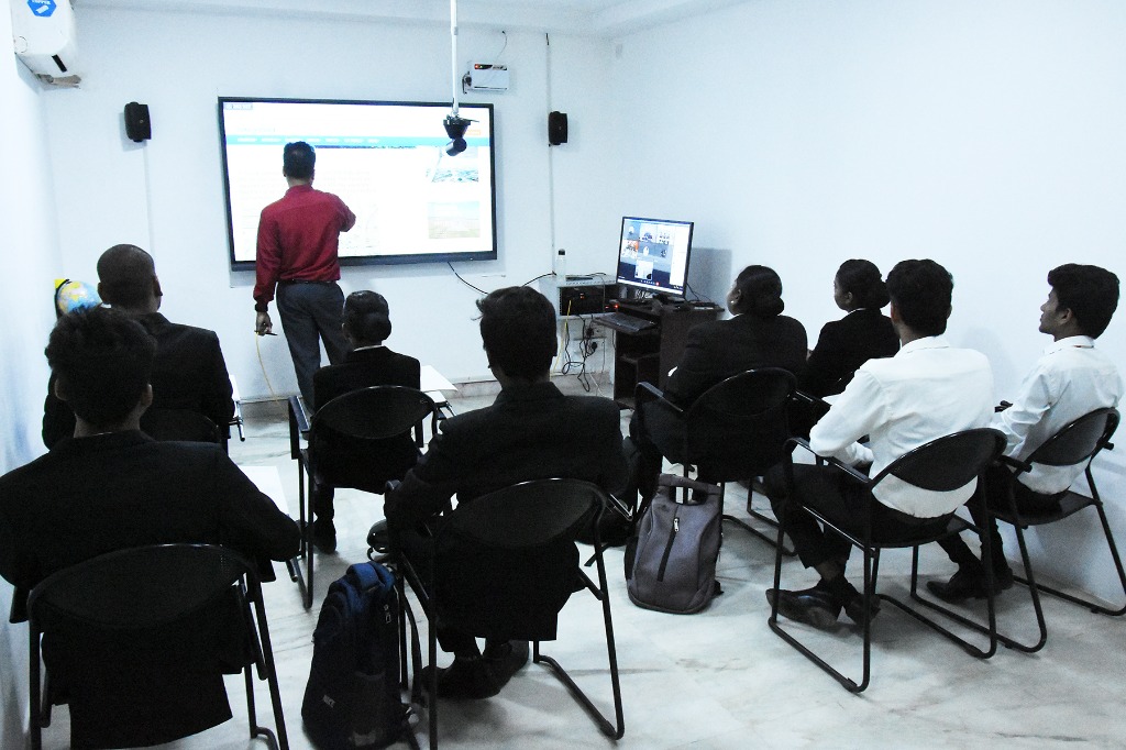 Aviation students watching a video presentation on airport operations at Fly Air Aviation Academy